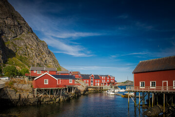 Obraz premium Traditional Norwegian houses near the lake. Fishing village. Wooden houses. Lofoten Islands, Norway