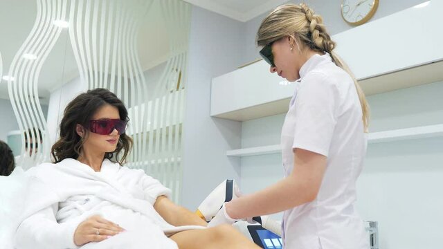 Laser epilation and cosmetology in beauty salon. Cosmetology, spa and hair removal concept