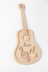 Guitar made of wood and plywood on a white background