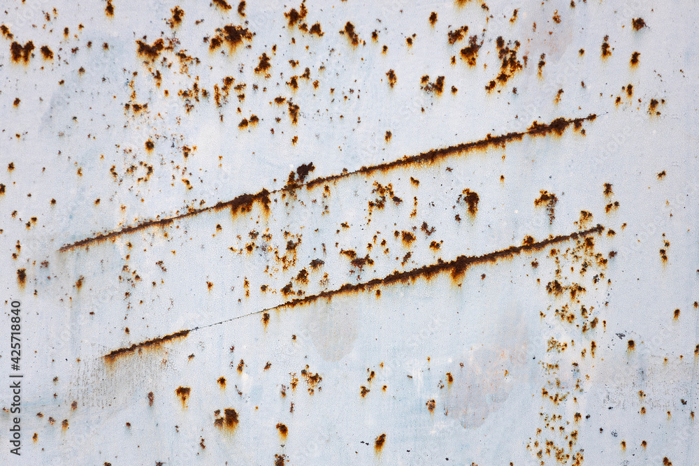 Poster gray metal wall with rust. highlighting with rust
