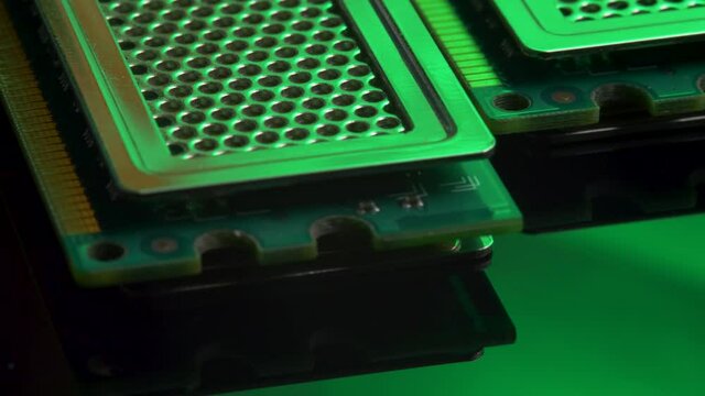 DDR RAM sticks on green light mirror background. Double Data Rate Random Access Memory. Computer memory module with contact pins. Heat spreader