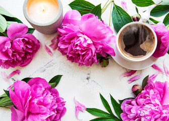 Pink peony flowers and cup of coffee