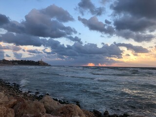 Tel Aviv Alma beach sunset over the sea, cloudy sky