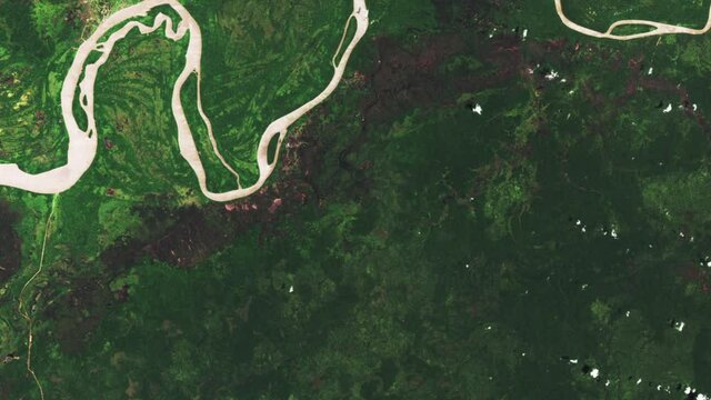 Human deforestation time lapse aerial satellite view on green rainforest in asian area, Papua and Indonesia. Images furnished by Nasa