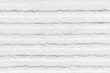 White wall with indentations and roughness on the surface and for texture or background