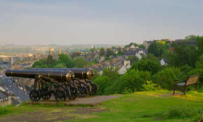 Fototapeta na wymiar The cannons on Mote Hill with a view of Stirling town centre below.