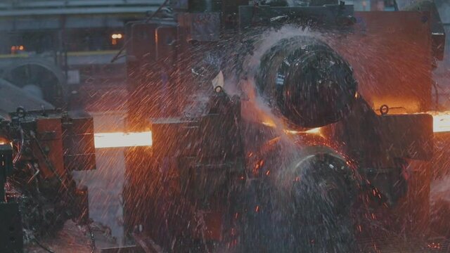 Metal production process in a metallurgical factory close-up. Red hot metal in a modern factory. Modern metallurgical factory