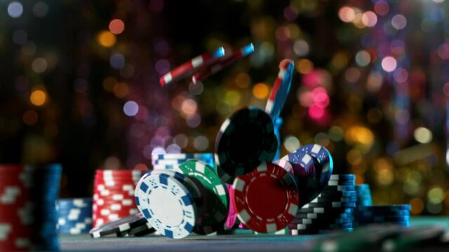 Poker chips falling on casino table in super slow motion, filmed on high speed cinema camera