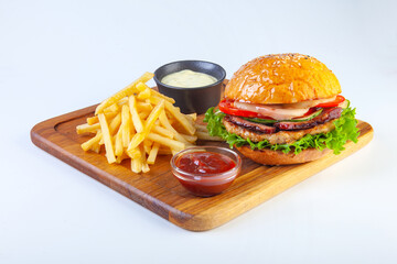juicy hamburger on a white plate in the studio