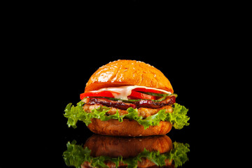 juicy hamburger on a black background in the studio