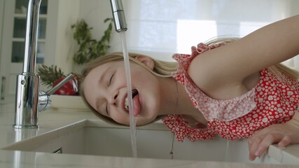 Girl tries drink tap water