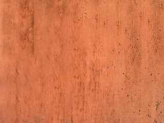 Old exfoliating brown paint from the wood surface of the board close-up.Texture or background