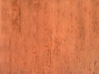 Old exfoliating brown paint from the wood surface of the board close-up.Texture or background