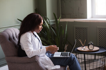 telehealth with virtual female doctor appointment and online therapy session. Black female doctor...