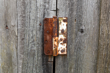 Old rusty metal door hinge