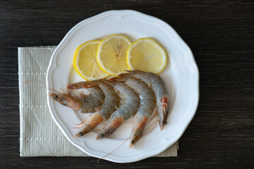 Whole fresh raw shrimps seafood in a plate ready to cook