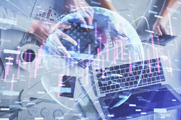Fototapeta premium Double exposure of man and woman working together and financial chart hologram drawing. market analysis concept. Computer background. Top View.