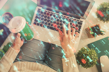 Double exposure of woman hands working on computer and data theme hologram drawing. Top View. Technology concept.