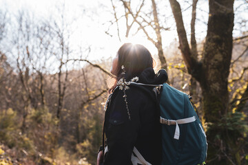 Woman hiking at sunset, outdoors