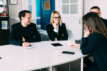 Businesspeople discussing together in conference room during meeting at office. Team work.