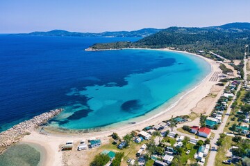 Beautiful Beach With Golden Sand And Clear Water. Turquoise coast with blue water and golden sand in Europe aerial drone photo
