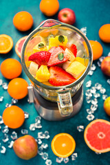 Variation of fruits in mixer. Preparing milkshake or smoothie