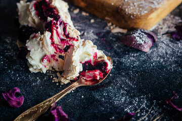 Meringue roll with berries. Delicious meringue roll on the table 