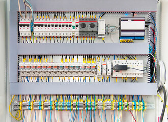 Electrical switchboard with different colored wires, switches and sensors
