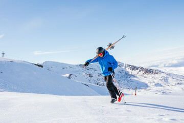 Naklejka na ściany i meble Ski. Skier. Skier walking on the snowy mountain. Skier walking in the snow. Snowy mountain. High mountain. Extreme sports. Sierra Nevada