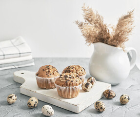 Easter sweet homemade cupcake and quail eggs. Greeting card. Festive food. Table with treats. Homemade cakes and desserts