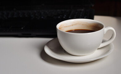 cup of black coffee on work place