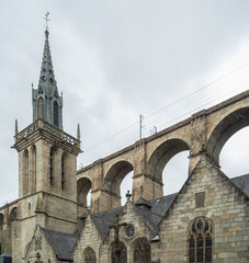 Historic church of Morlaix, France, with the railway bridge high above the city