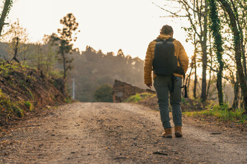 Woman hiking in the mountains. Hiking with black backpack