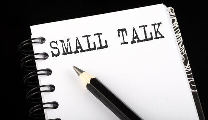 SMALL TALK written text in a small notebook on a black background