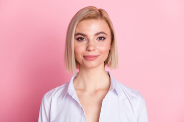 Photo of lovely charming young woman wear blue shirt blonde hair isolated on pastel pink color...