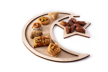 Assortment of Ramadan dessert baklava and dates isolated on white background	