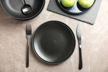 Set of clean dishware on grey table, flat lay