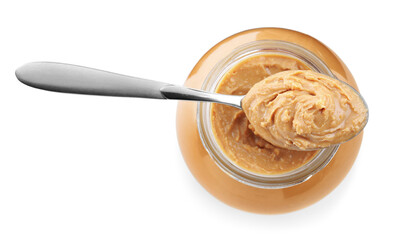 Glass jar and spoon with tasty peanut butter isolated on white, top view