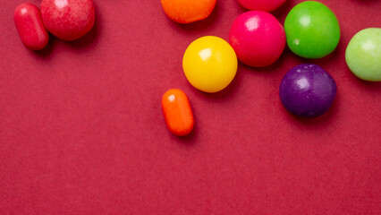 colorful little candies on a colored background