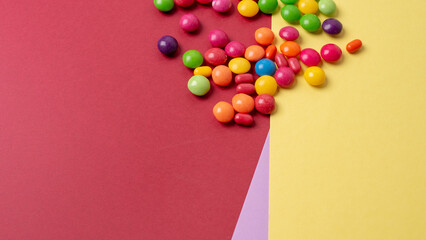 Obraz premium colorful little candies on a colored background
