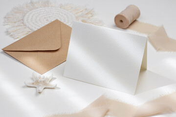 Fototapeta na wymiar 5,5x4,25 card mockup with craft envelope and starfish