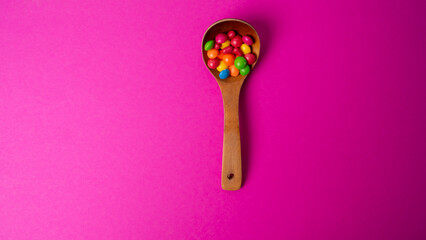 multicolored candy set with a wooden spoon