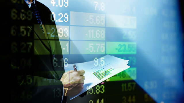 Double exposure of young business man and digital number of stock market background to represent successful in investment marketing. Find out the best solution in business and financial as concept.