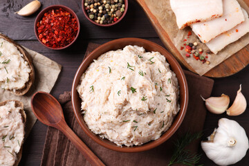Delicious lard spread served on wooden table, flat lay