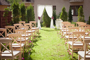 Wedding set up in a garden. Wedding ceremony & Wedding decorations/Wedding Archway/Wedding Archway with peony decorations