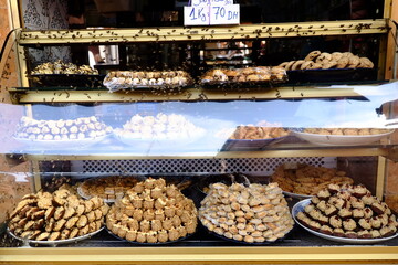 Moroccan sweets store occupied by a swarm of bees 