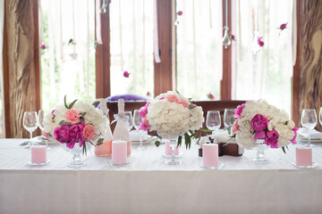 Wedding ceremony decoration in the restaurant. Decoration of wedding table with tender pink textile