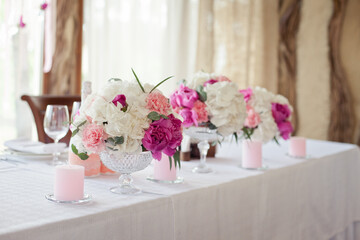 Wedding ceremony decoration in the restaurant. Decoration of wedding table with tender pink textile