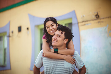 Young happy couple on the street.