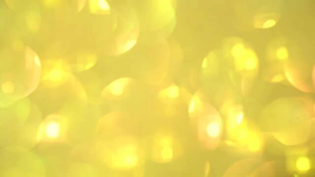 Festive yellow background with sequins and rhinestones. High quality video